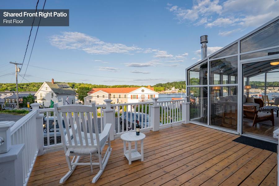 Outdoor patio with seating overlooking Boothbay Harbor