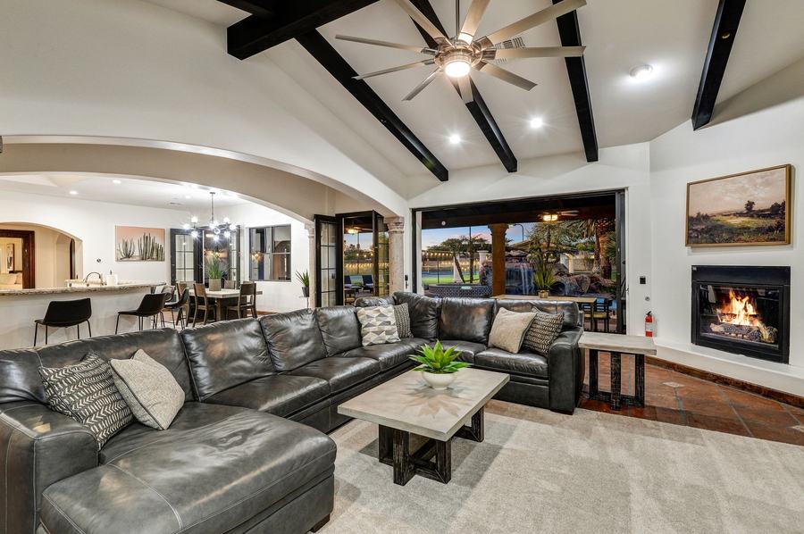 Living Room at Night with Fireplace & Courtyard Views