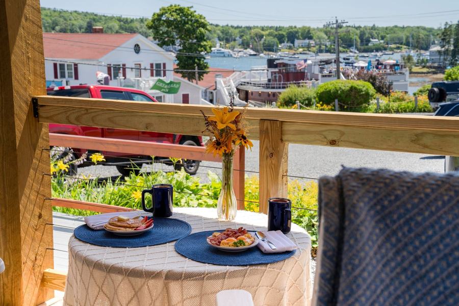 Outdoor table set for breakfast overlooking Boothbay Harbor