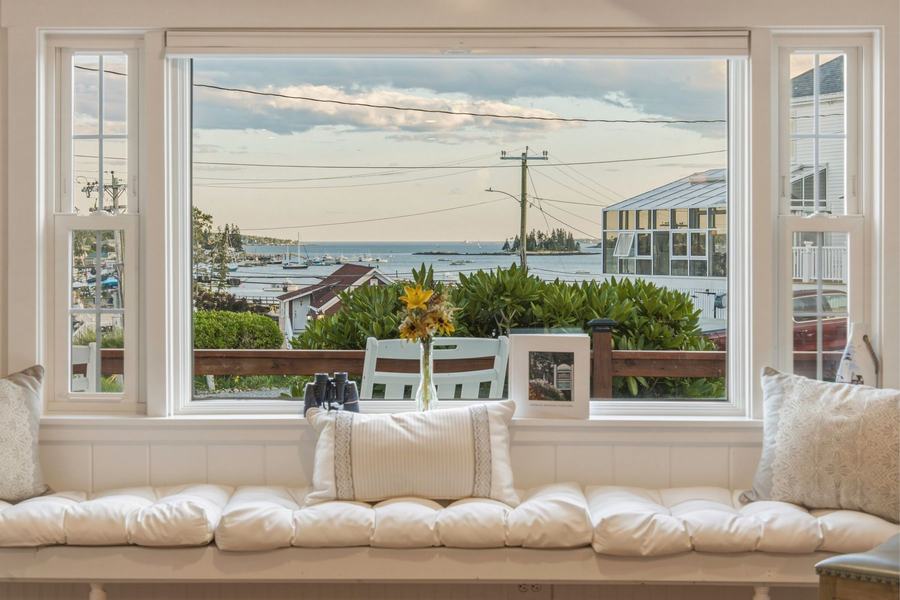 Cushioned window seat overlooking Boothbay Harbor and the waterfront