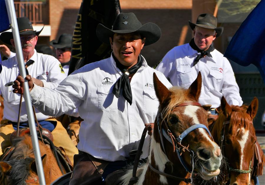 Riders and floats in the Parada del Sol parade during Scottsdale Western Week