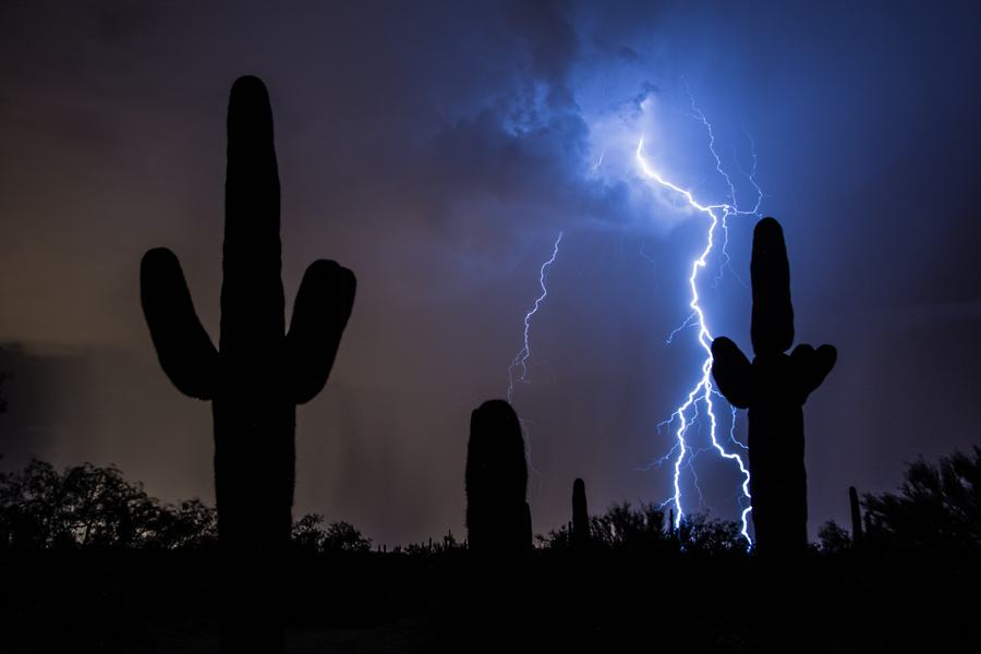 Scottsdale villa pool at dusk under gathering monsoon clouds