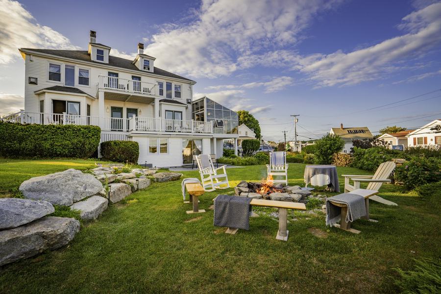 Admiral's Quarters Inn at dusk from the harbor lawn