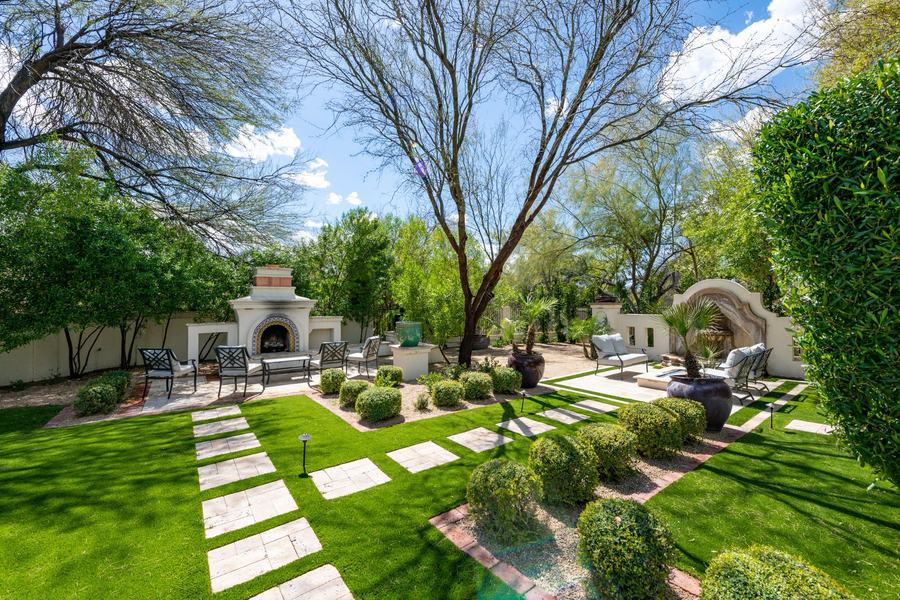 The Backyard with Lush Green Landscaping & Seating