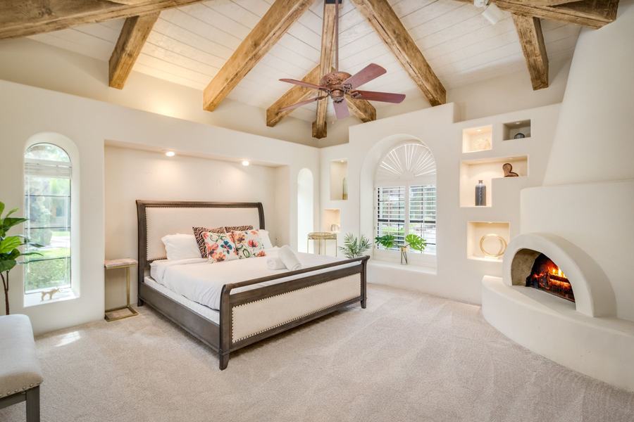 Main Floor Primary Bedroom with King Bed & Private Wing